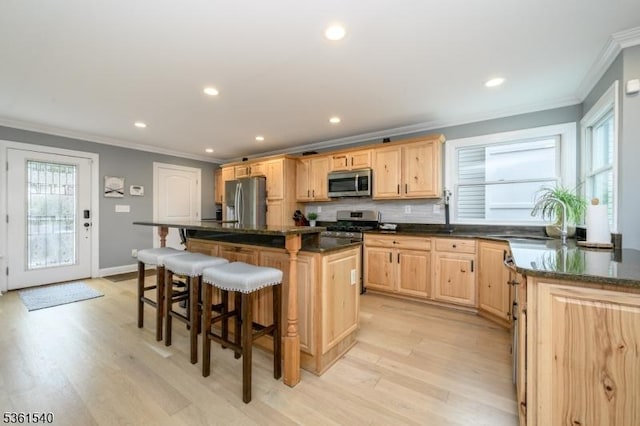 307 Squaw Trl, Hopatcong Boro, NJ 07821 - kitchen featuring stainless steel appliances, ornamental molding, light brown cabinets, a sink, and a center island