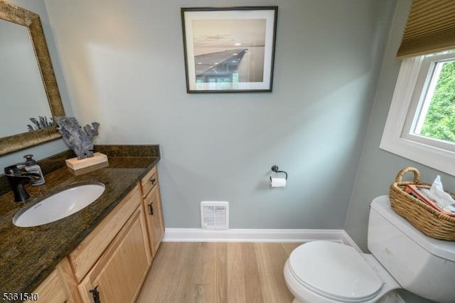 307 Squaw Trl, Hopatcong Boro, NJ 07821 - bathroom with toilet, baseboards, vanity, and wood finished floors