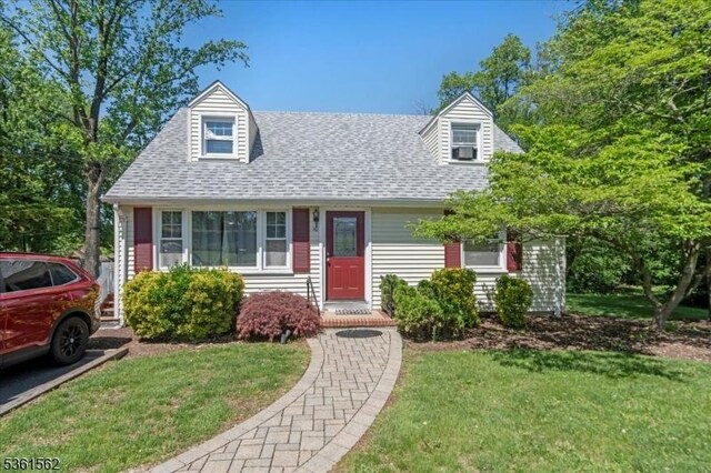 10 Hanover Ave, Hanover Twp, NJ 07981 - cape cod home featuring a front yard and roof with shingles