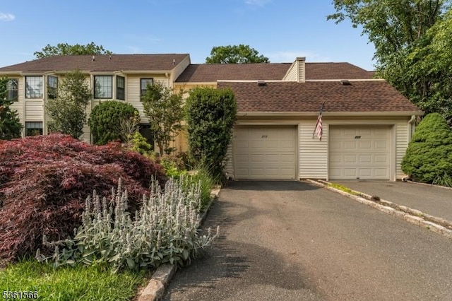 205 Burlington Ct, Raritan Twp, NJ 08822 - view of front of house featuring asphalt driveway, an attached garage, and roof with shingles