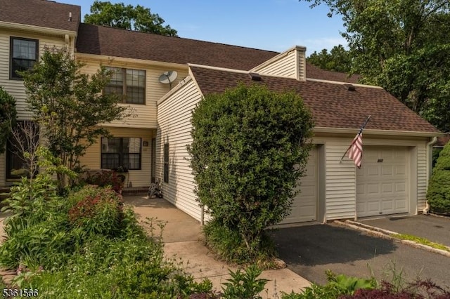 205 Burlington Ct, Raritan Twp, NJ 08822 - view of front facade featuring driveway, a shingled roof, and an attached garage