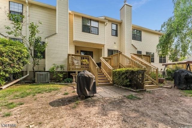 205 Burlington Ct, Raritan Twp, NJ 08822 - back of house featuring a chimney, stairs, a wooden deck, and central air condition unit