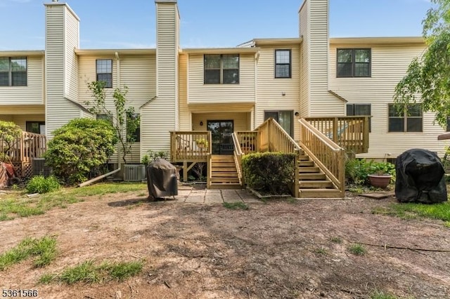 205 Burlington Ct, Raritan Twp, NJ 08822 - back of property featuring a wooden deck, a chimney, stairs, and central AC