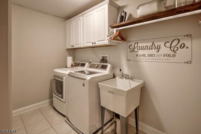 302 Lindabury Ln, Tewksbury Twp, NJ 07979 - laundry room featuring washer and dryer, cabinet space, and light tile patterned floors