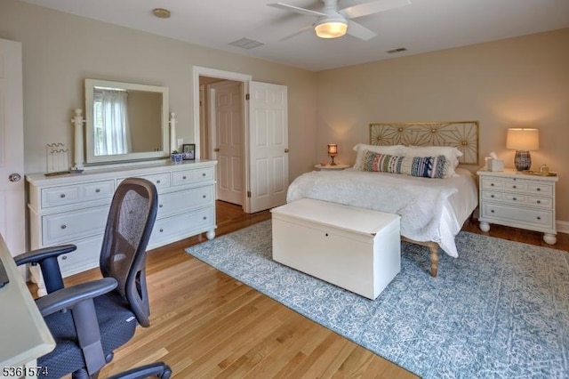 302 Lindabury Ln, Tewksbury Twp, NJ 07979 - bedroom with wood finished floors, a desk, and a ceiling fan