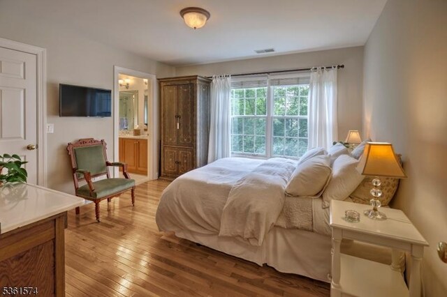 302 Lindabury Ln, Tewksbury Twp, NJ 07979 - bedroom featuring light wood-style flooring and connected bathroom