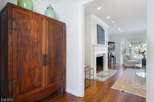 50H New England Ave Unit H, Summit City, NJ 07901 - living room with ornamental molding, dark wood-style floors, a fireplace with raised hearth, baseboards, and recessed lighting