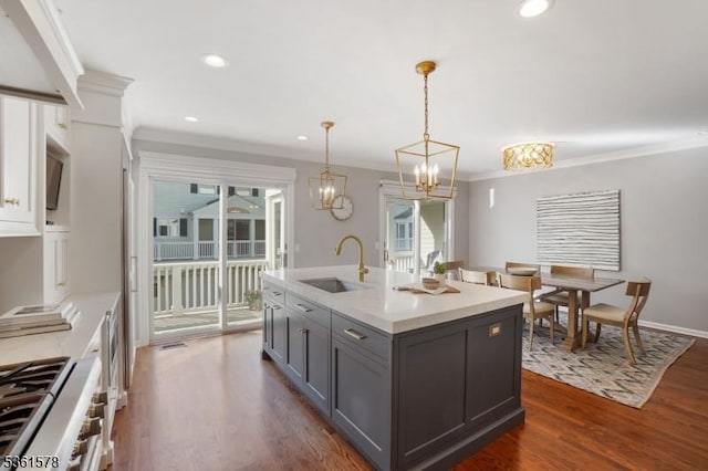 50H New England Ave Unit H, Summit City, NJ 07901 - kitchen with gray cabinetry, a sink, light countertops, dark wood-style flooring, and a chandelier