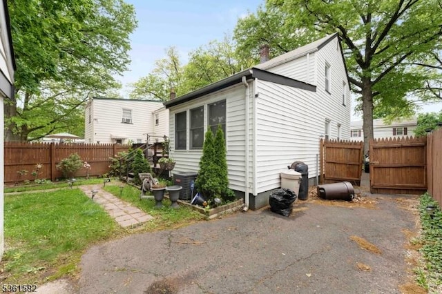 420 Hollywood Ave, Hillside Twp, NJ 07205 - back of house featuring a fenced backyard and a chimney