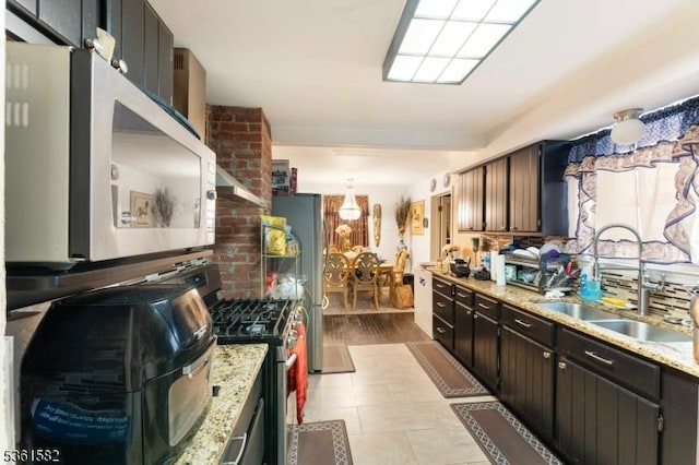 420 Hollywood Ave, Hillside Twp, NJ 07205 - kitchen featuring a sink, stainless steel appliances, and light stone counters