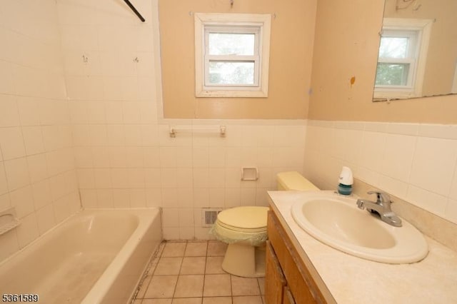 328 Ralph St, Franklin Twp, NJ 08873 - full bath with tile walls, vanity, toilet, tile patterned floors, and a wainscoted wall