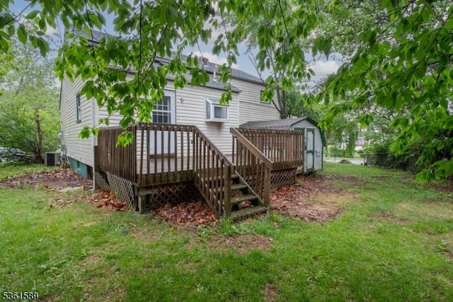 328 Ralph St, Franklin Twp, NJ 08873 - back of property featuring a wooden deck, central air condition unit, and a lawn