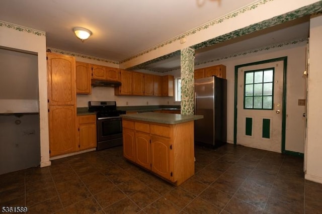 328 Ralph St, Franklin Twp, NJ 08873 - kitchen with stainless steel appliances, under cabinet range hood, a kitchen island, dark countertops, and dark tile patterned flooring