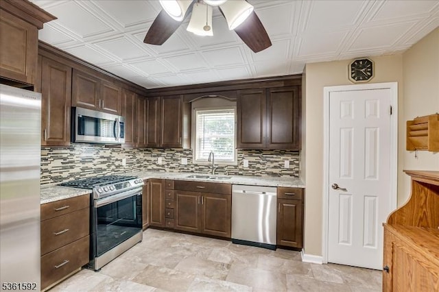 73-81 Mariners Ct, Plainfield City, NJ 07063 - kitchen with stainless steel appliances, backsplash, ceiling fan, an ornate ceiling, and dark brown cabinets