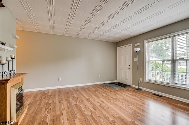 73-81 Mariners Ct, Plainfield City, NJ 07063 - entryway featuring light wood-type flooring and a tiled fireplace