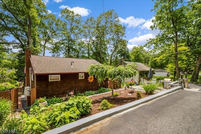 86 W Shawnee Trl, Jefferson Twp, NJ 07885 - view of front of house with a chimney and roof with shingles