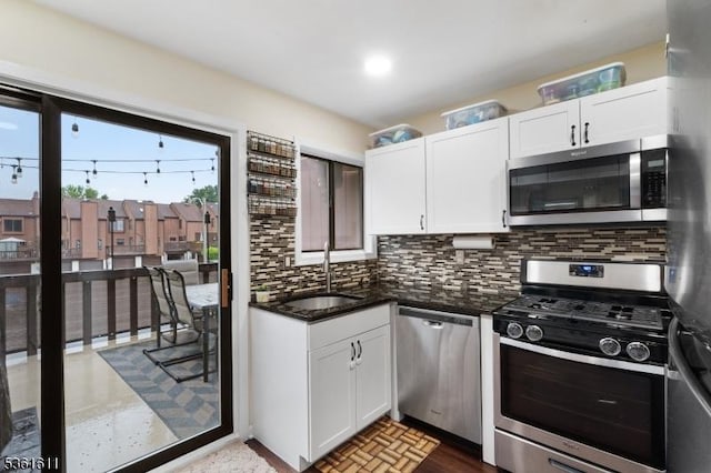 35 Bennington Sq, Washington Twp, NJ 07840 - kitchen featuring stainless steel appliances, decorative backsplash, white cabinetry, and dark stone countertops