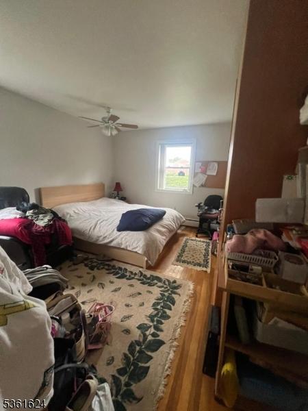 37 Manchester Ct Unit 121, Wayne Twp, NJ 07470 - bedroom featuring wood finished floors and ceiling fan