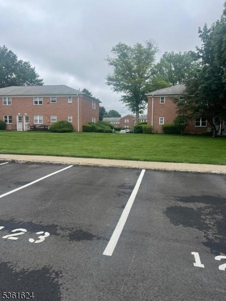 37 Manchester Ct Unit 121, Wayne Twp, NJ 07470 - view of uncovered parking lot