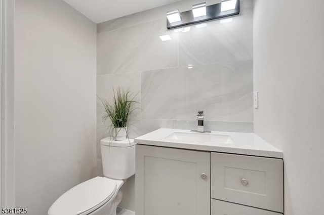 139 Weaver Ave, Bloomfield Twp, NJ 07003 - half bath featuring vanity, toilet, and tile walls