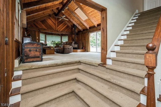 90 Libertyville Rd, Wantage Twp, NJ 07461 - stairway featuring wooden ceiling with exposed beams, wood walls, and high vaulted ceiling