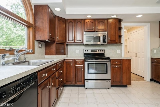 90 Libertyville Rd, Wantage Twp, NJ 07461 - kitchen with appliances with stainless steel finishes, a sink, light countertops, light floors, and recessed lighting