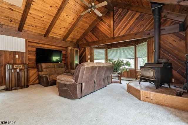 90 Libertyville Rd, Wantage Twp, NJ 07461 - carpeted living area with wooden walls, wooden ceiling with exposed beams, a wood stove, a ceiling fan, and high vaulted ceiling