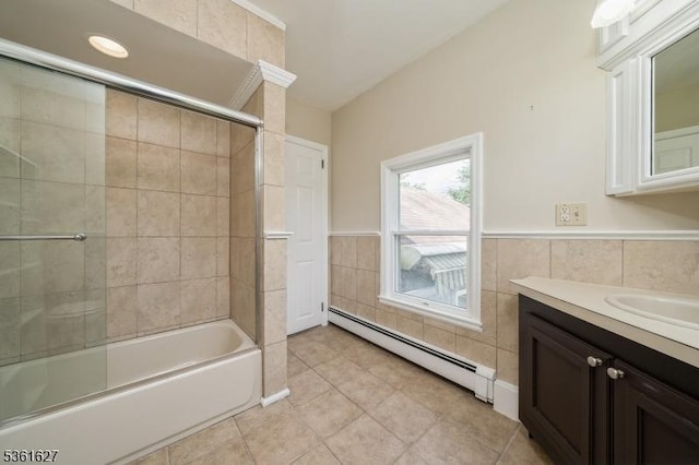 90 Libertyville Rd, Wantage Twp, NJ 07461 - bathroom featuring baseboard heating, tile walls, vanity, shower / bath combination with glass door, and tile patterned floors