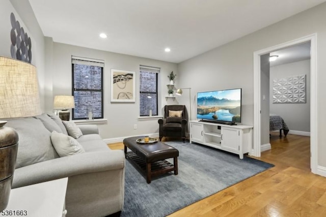 3315 Pleasant Ave Unit 314, Union City, NJ 07087 - living area featuring wood finished floors, baseboards, and recessed lighting