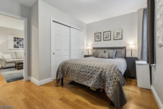 3315 Pleasant Ave Unit 314, Union City, NJ 07087 - bedroom with baseboards, a closet, and wood finished floors