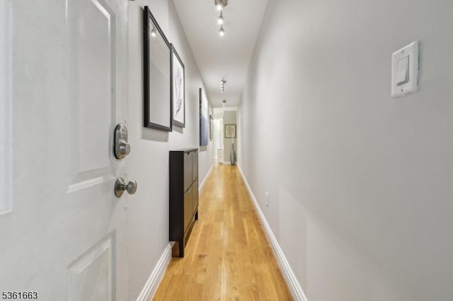3315 Pleasant Ave Unit 314, Union City, NJ 07087 - corridor with light wood finished floors, baseboards, and rail lighting