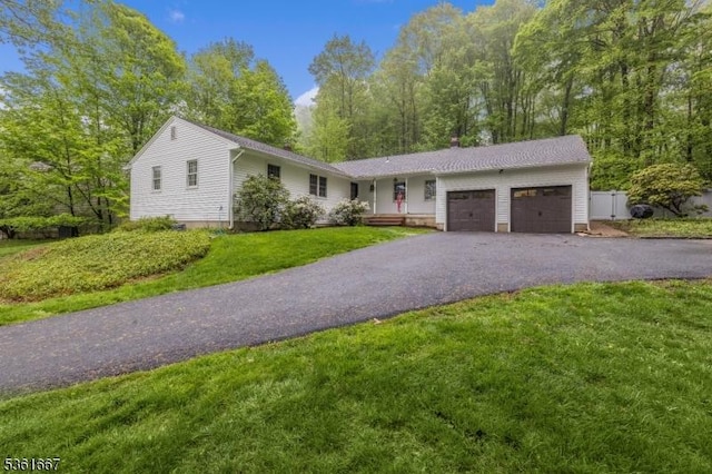 16 Old Chimney Rd, Randolph Twp, NJ 07869 - ranch-style house with an attached garage, asphalt driveway, and a front lawn