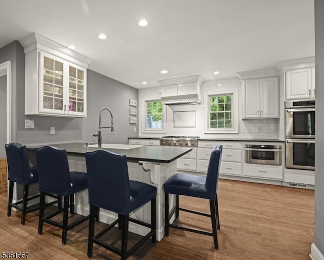 16 Old Chimney Rd, Randolph Twp, NJ 07869 - kitchen with a sink, stainless steel appliances, dark countertops, under cabinet range hood, and recessed lighting