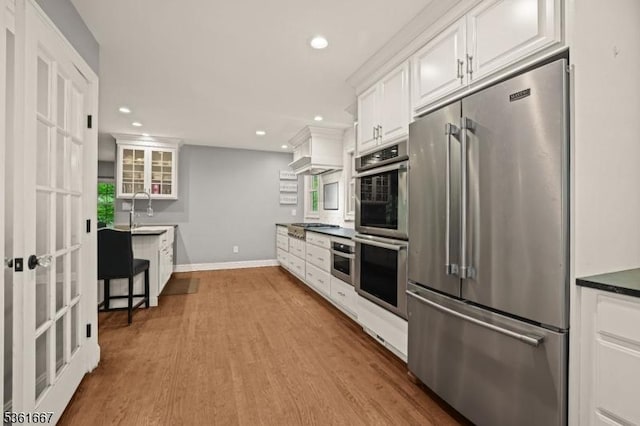 16 Old Chimney Rd, Randolph Twp, NJ 07869 - kitchen featuring stainless steel appliances, white cabinetry, recessed lighting, wood finished floors, and baseboards
