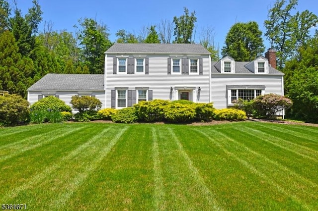 23 Pepperidge Rd, Morris Twp, NJ 07960 - colonial-style house featuring a chimney and a front yard