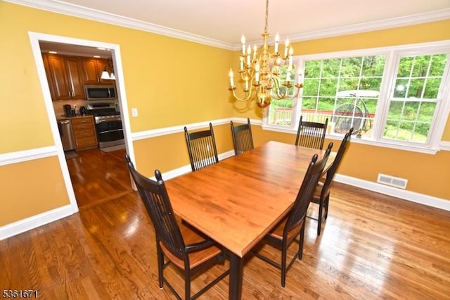 23 Pepperidge Rd, Morris Twp, NJ 07960 - dining area featuring ornamental molding, a chandelier, baseboards, and dark wood-style floors