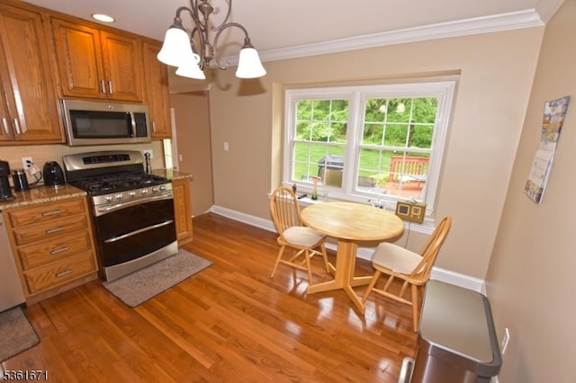 23 Pepperidge Rd, Morris Twp, NJ 07960 - kitchen featuring stainless steel appliances, crown molding, a chandelier, brown cabinets, and wood finished floors