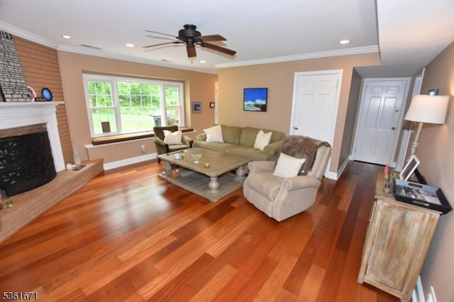 23 Pepperidge Rd, Morris Twp, NJ 07960 - living area with a ceiling fan, wood finished floors, baseboards, a brick fireplace, and ornamental molding