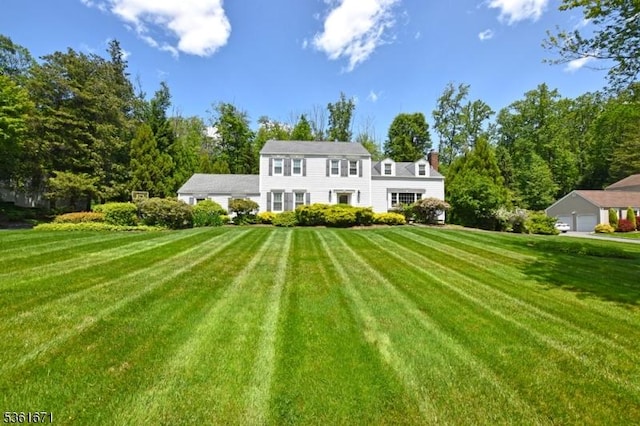 23 Pepperidge Rd, Morris Twp, NJ 07960 - rear view of house with a lawn and a chimney