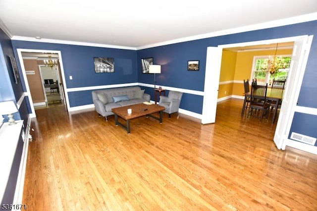 23 Pepperidge Rd, Morris Twp, NJ 07960 - living area featuring a chandelier, wood finished floors, baseboards, and ornamental molding