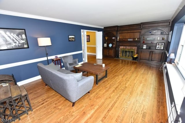 23 Pepperidge Rd, Morris Twp, NJ 07960 - living area with ornamental molding, light wood-style flooring, baseboards, and a baseboard heating unit