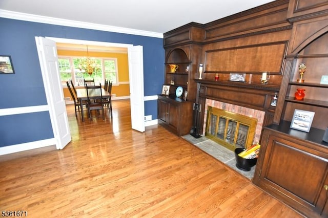 23 Pepperidge Rd, Morris Twp, NJ 07960 - living room featuring a fireplace with flush hearth, wood finished floors, a chandelier, baseboards, and ornamental molding