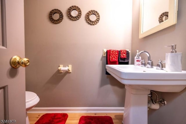 17 Iron Forge Vlg S, Pompton Lakes Boro, NJ 07442 - bathroom with toilet, baseboards, and wood finished floors