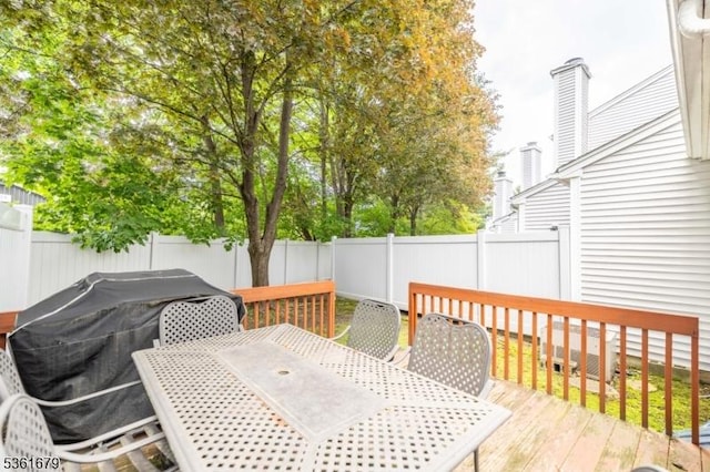 17 Iron Forge Vlg S, Pompton Lakes Boro, NJ 07442 - wooden terrace with outdoor dining space and a fenced backyard