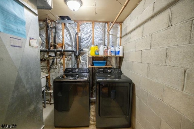 17 Iron Forge Vlg S, Pompton Lakes Boro, NJ 07442 - laundry area with washer and clothes dryer, concrete block wall, and heating unit
