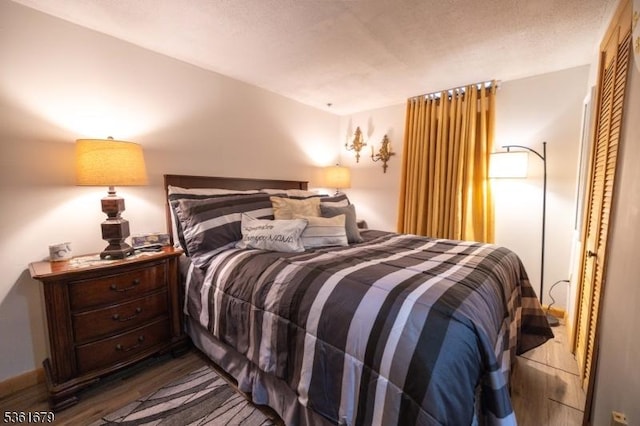 17 Iron Forge Vlg S, Pompton Lakes Boro, NJ 07442 - bedroom with wood finished floors and a closet