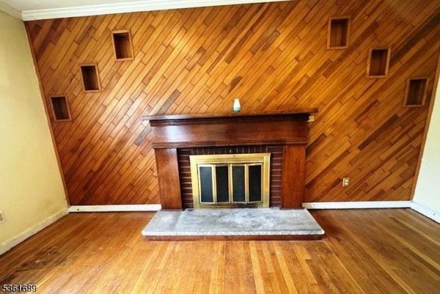 17 Hilltop Cir, Hanover Twp, NJ 07981 - detailed view of baseboards, a brick fireplace, wood walls, and wood finished floors