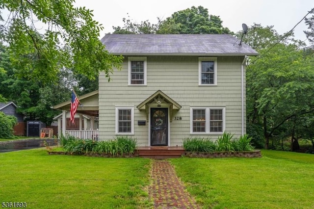 328 John St, Bound Brook Boro, NJ 08805 - colonial home featuring a front lawn