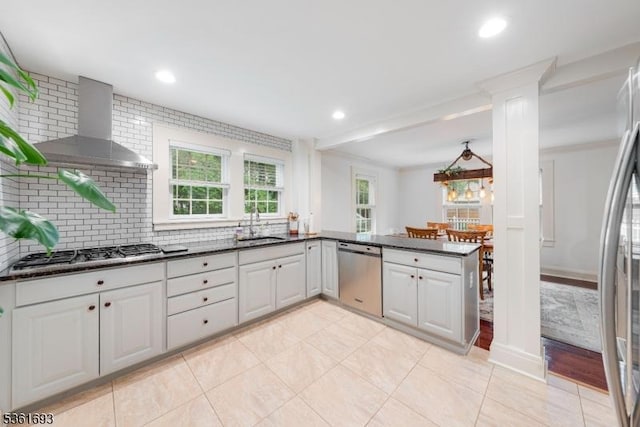 328 John St, Bound Brook Boro, NJ 08805 - kitchen featuring appliances with stainless steel finishes, wall chimney range hood, healthy amount of natural light, tasteful backsplash, and recessed lighting