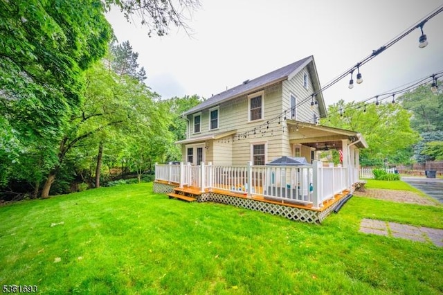 328 John St, Bound Brook Boro, NJ 08805 - rear view of property with a yard and a wooden deck